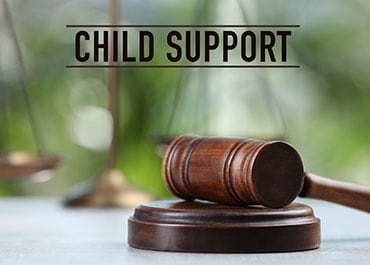 Child Support written in bold, with a gavel symbolizing child support modifications in Colorado - Law Firm of Tammy W. Akers, LLC